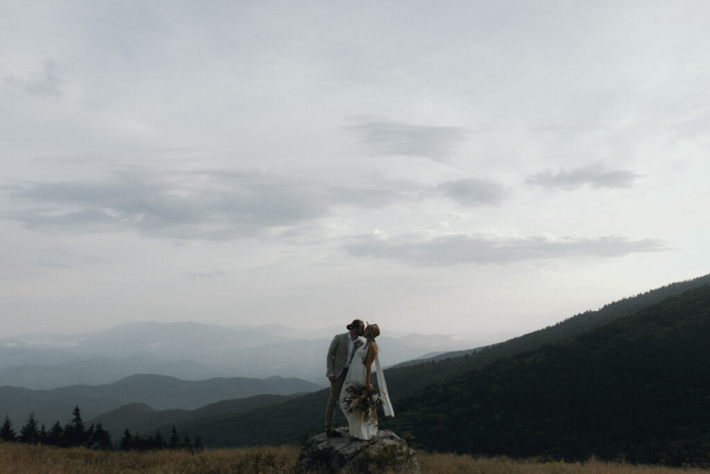 couple has wedding on mountain side on roan mountain
