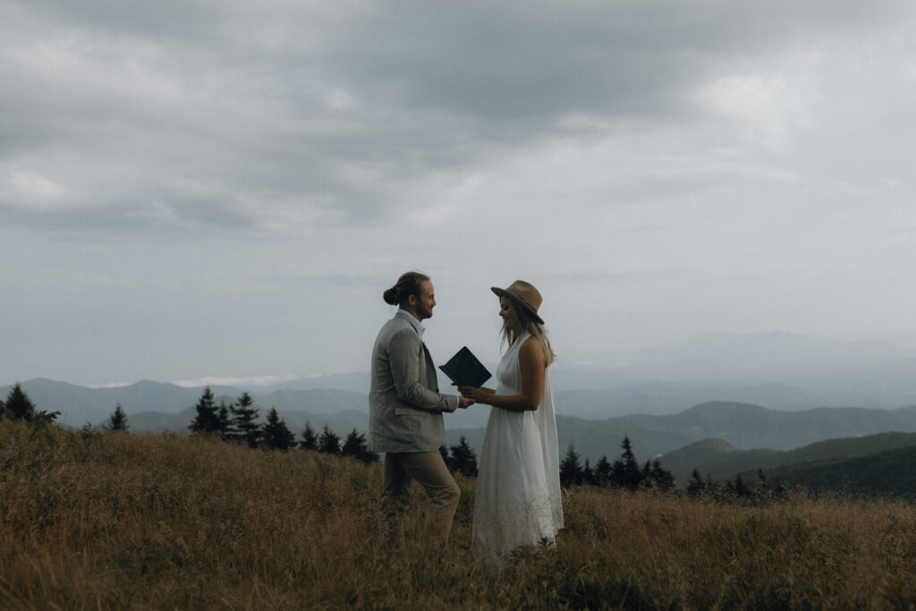 couple says vows on mountain side in roan mountain North Carolina 