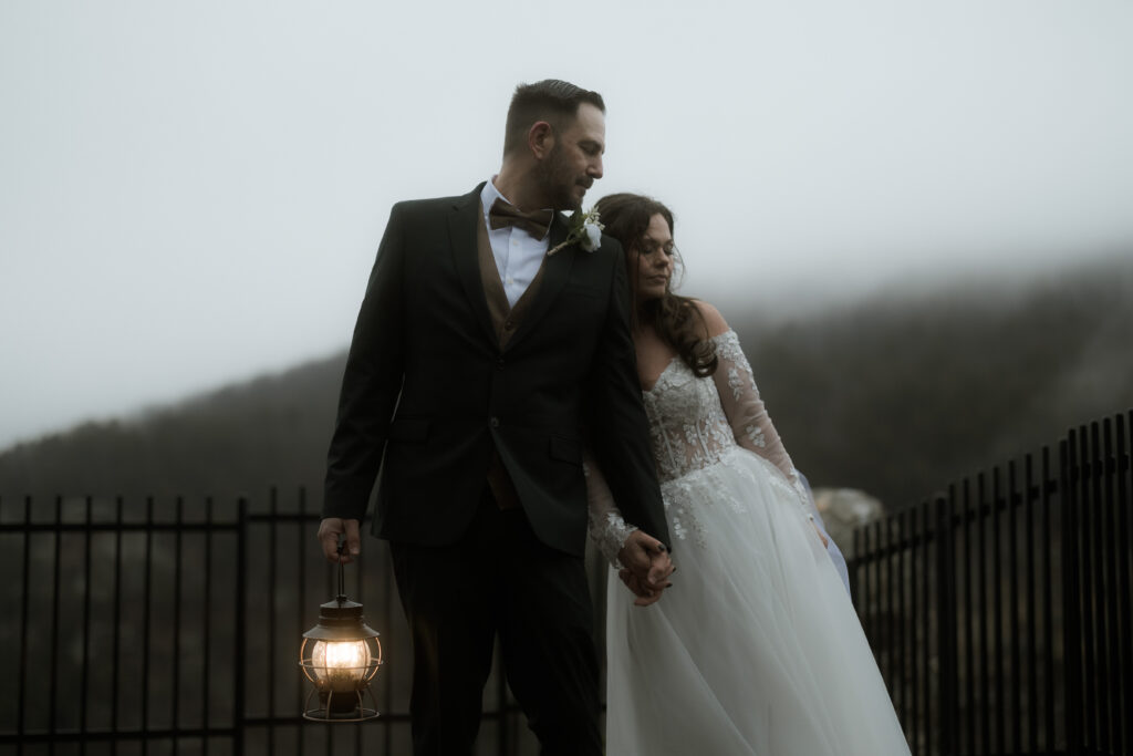 Bride and groom sharing a quiet moment in front of a waterfall during their Cloudland Canyon State Park elopement in winter