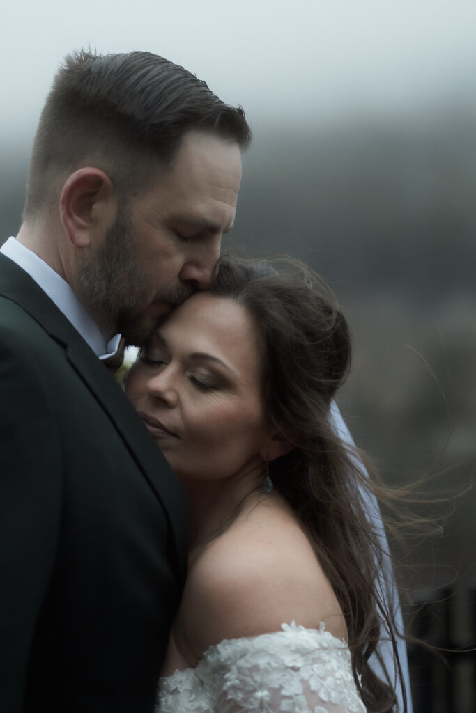 Couple walking along a forest trail during their Cloudland Canyon State Park elopement in winter.