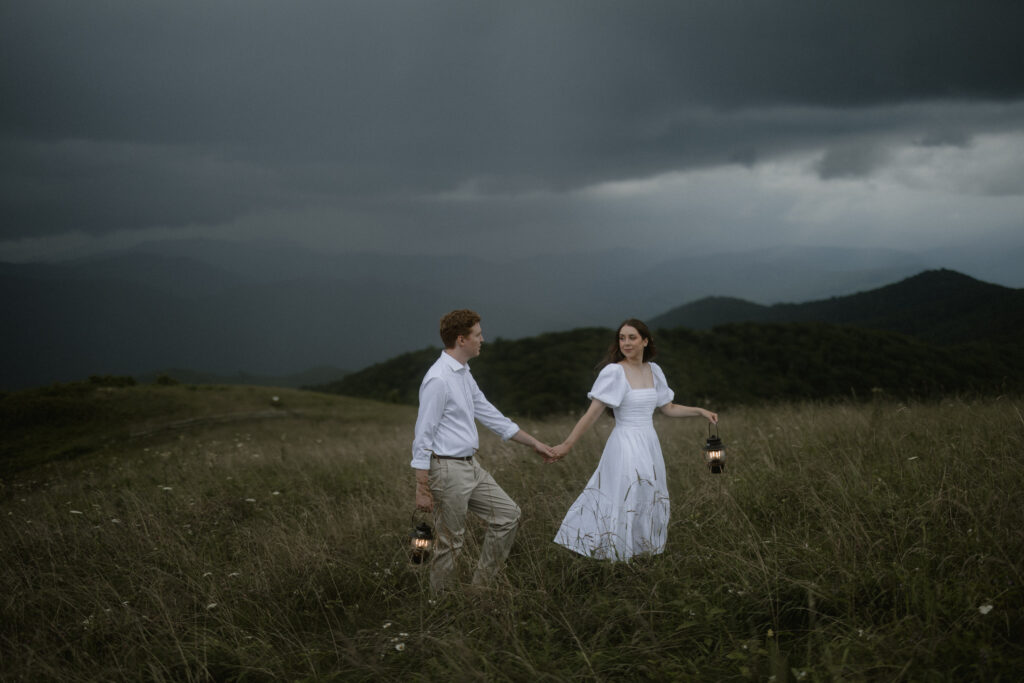 Couple engagement session walking hand in hand at Max Patch in Asheville North Carolina photographer