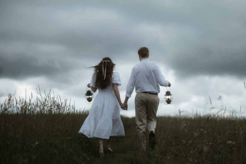 Couple engagement session walking hand in hand at Max Patch in Asheville North Carolina photographer