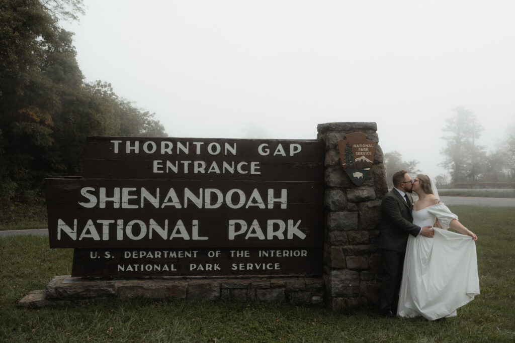 An intimate elopement on Upper Hawksbill Trail in Shenandoah National Park, Virginia. The couple hiked to the summit at sunrise, exchanging vows in a foggy, magical setting with breathtaking mountain views and their closest family and friends