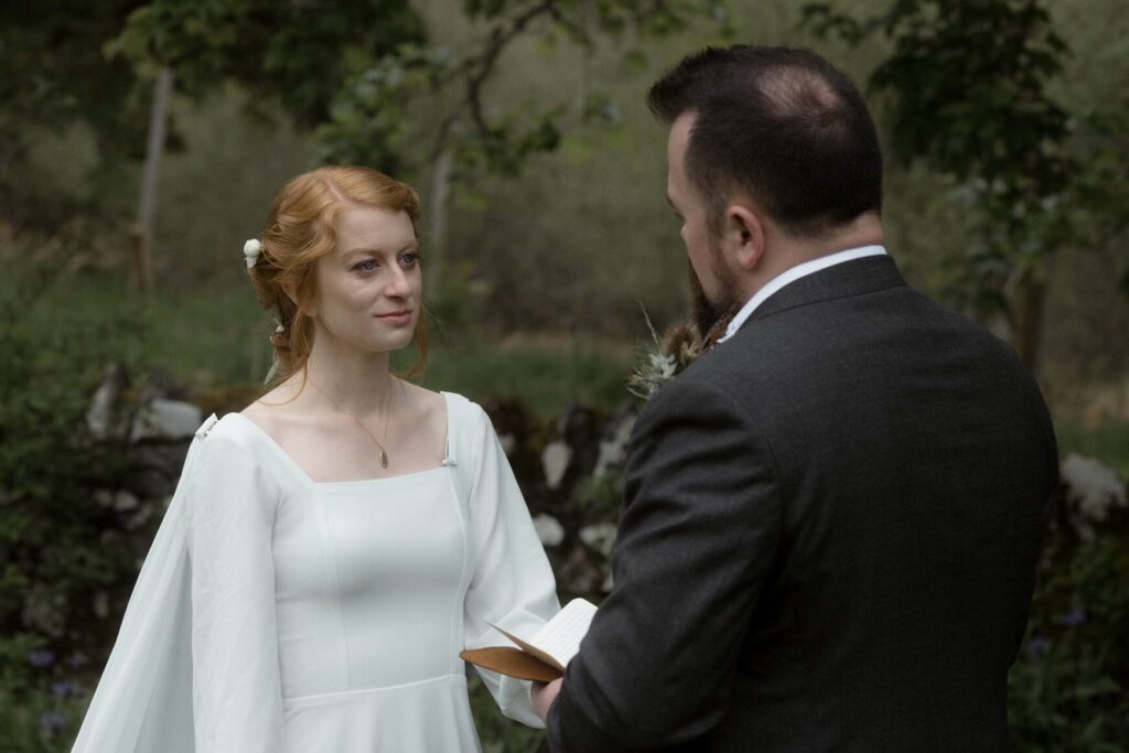 Bride and groom during an intimate Scotland destination wedding in the Scottish Highlands, captured with candid, cinematic wedding photography.