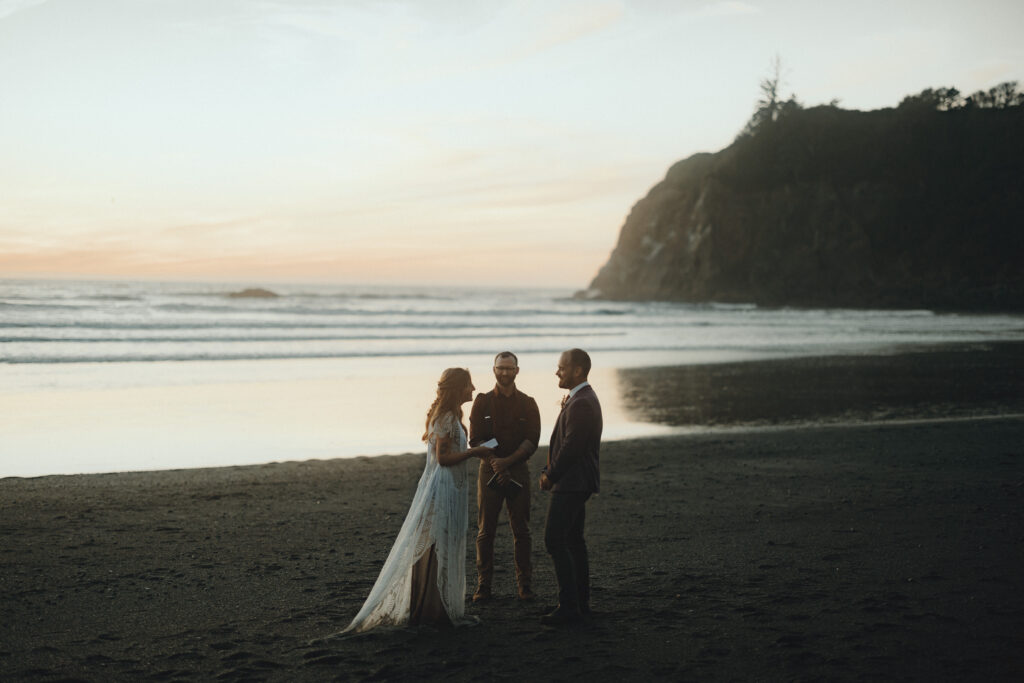 Couple exploring the shoreline of Ruby Beach after their summer elopement ceremony in Olympic National Park, Washington.
