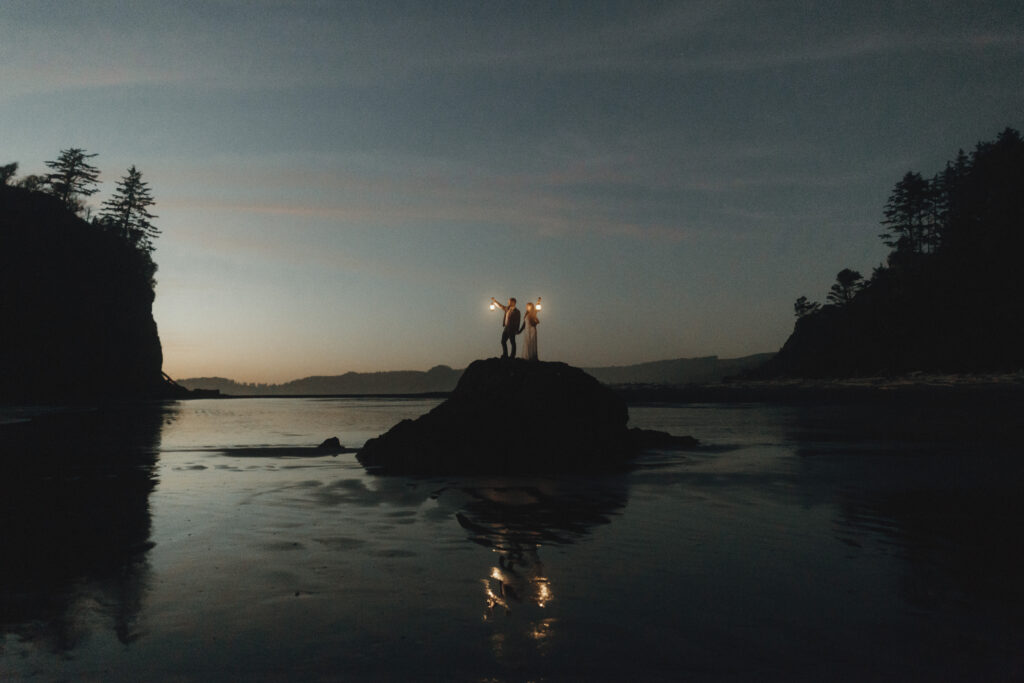 Couple exploring the shoreline of Ruby Beach after their summer elopement ceremony in Olympic National Park, Washington.