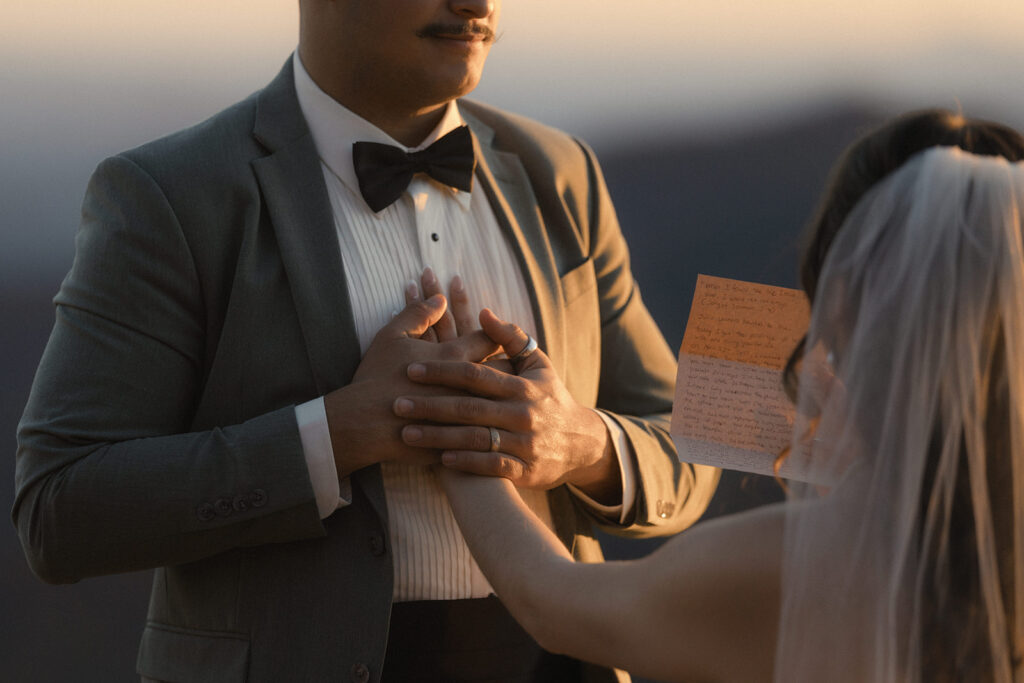 Emotional moment between bride and groom during their autumn Asheville mountain elopement ceremony