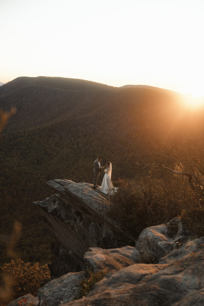 Golden hour portrait of couple during their October Asheville mountain elopement with fall foliage