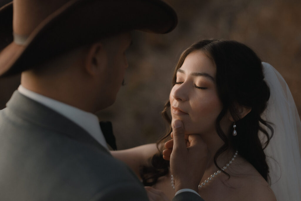 Emotional moment between bride and groom during their autumn Asheville mountain elopement ceremony