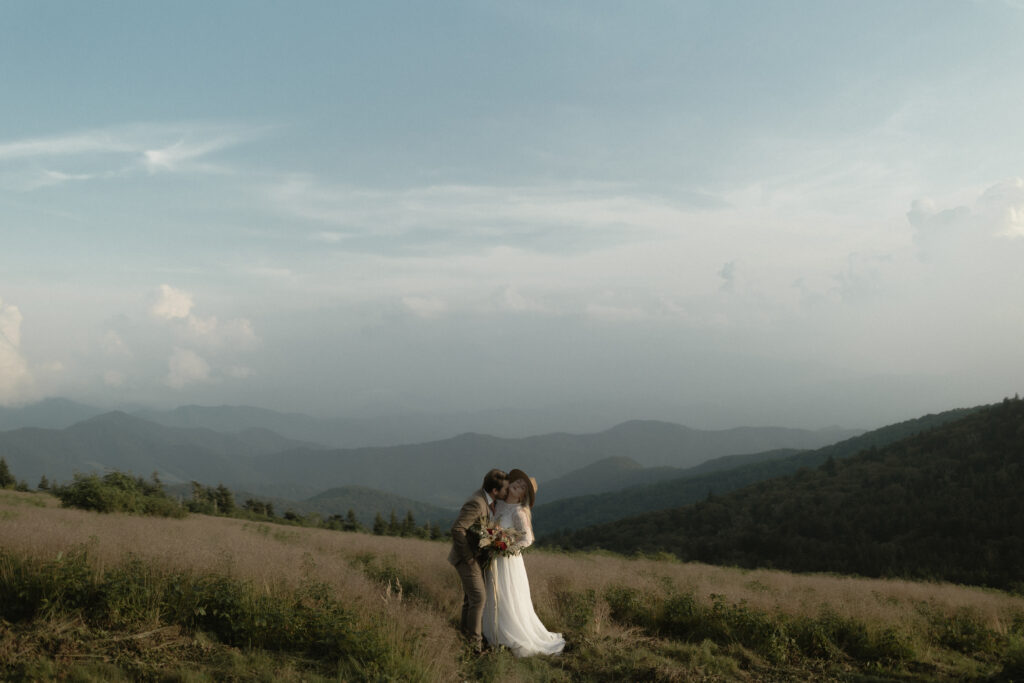 Golden hour light over lush summer mountains during an intimate Blue Ridge Parkway elopement