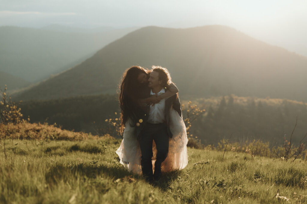 Romantic summer mountain elopement on the Blue Ridge Parkway with layered North Carolina ridgelines